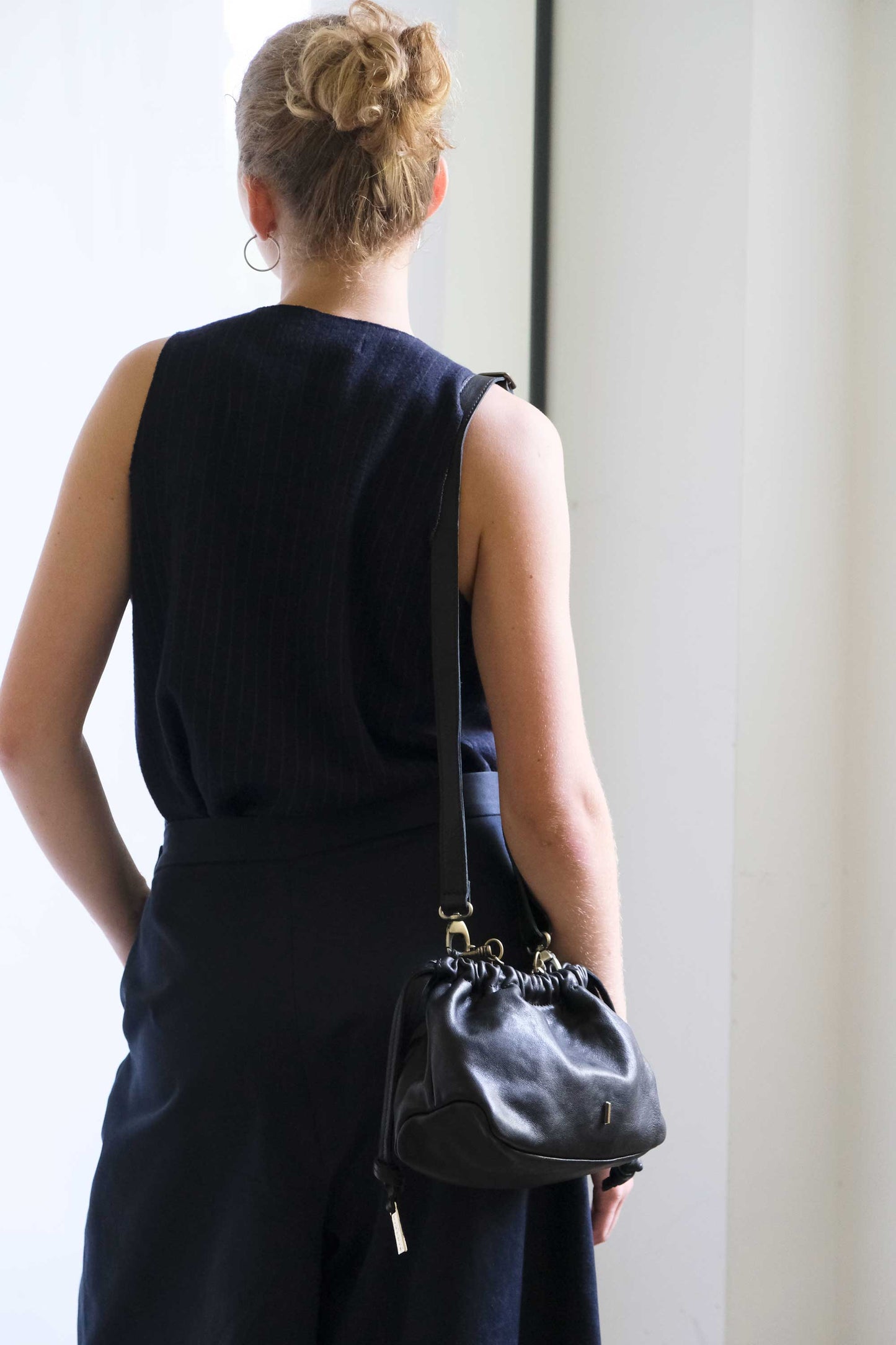 Agnes mini pochette in black nappa vegetable leather