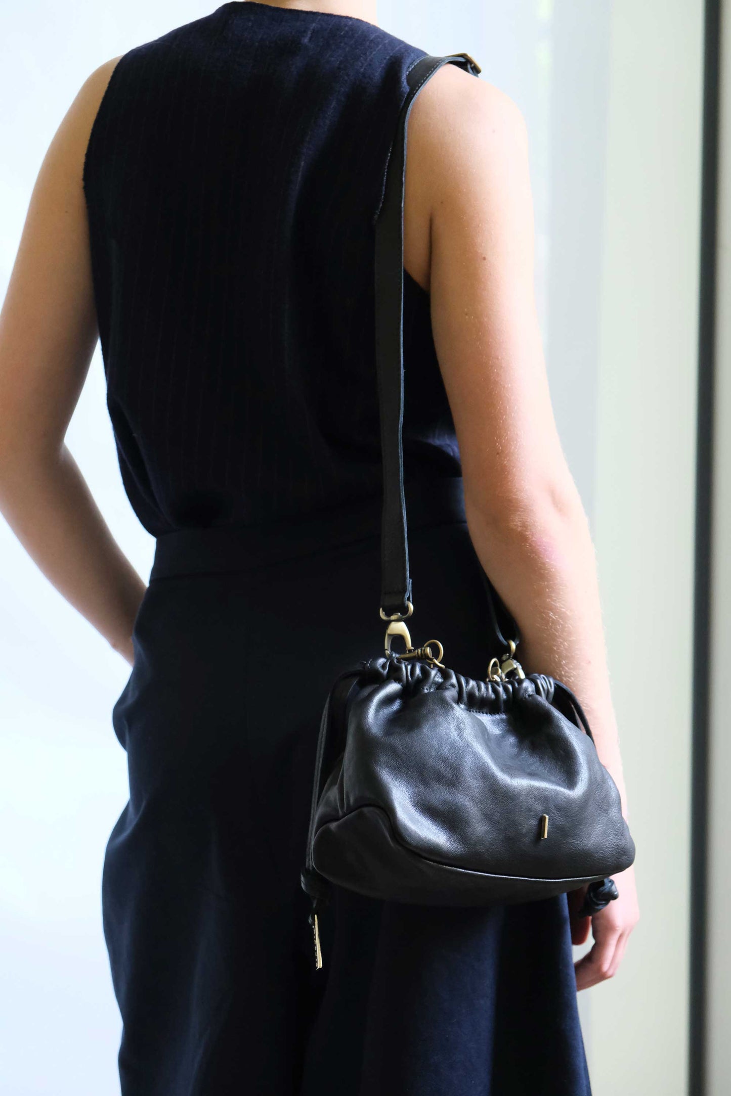 Agnes mini pochette in black nappa vegetable leather