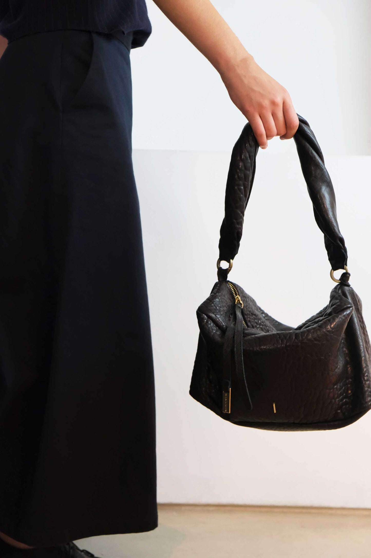 Bobo Torchon top handle bag in mutton vegetable leather