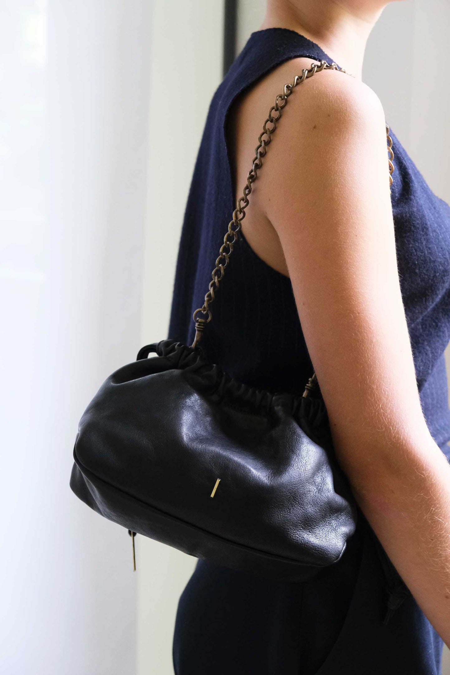 Agnes mini pochette in black nappa vegetable leather