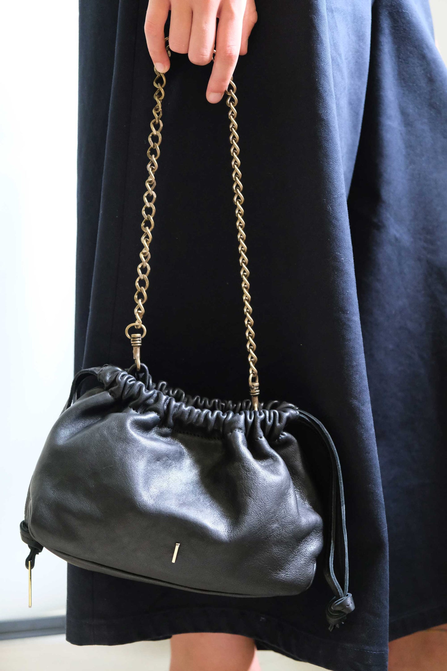 Agnes mini pochette in black nappa vegetable leather