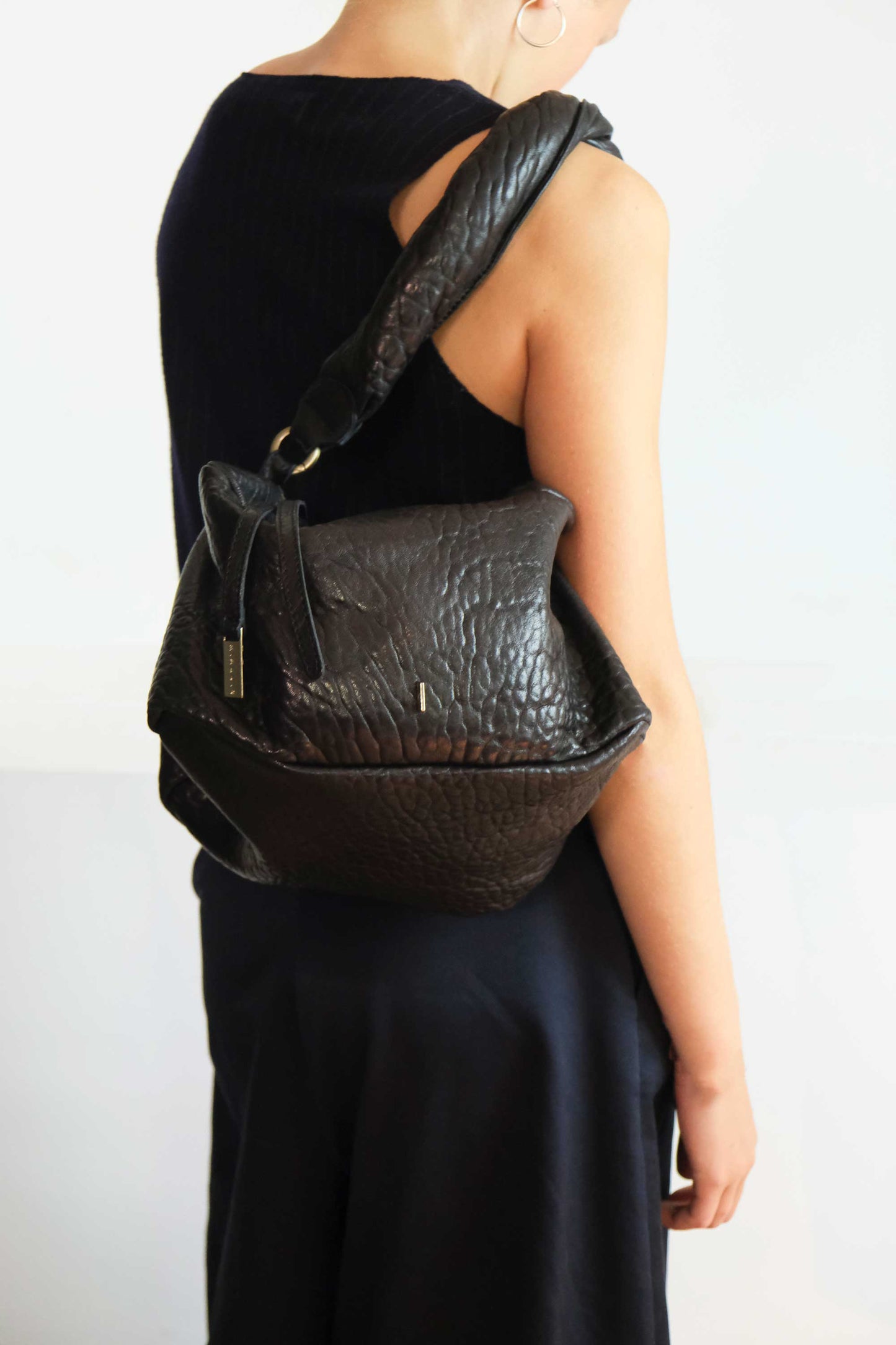 Bobo Torchon top handle bag in mutton vegetable leather