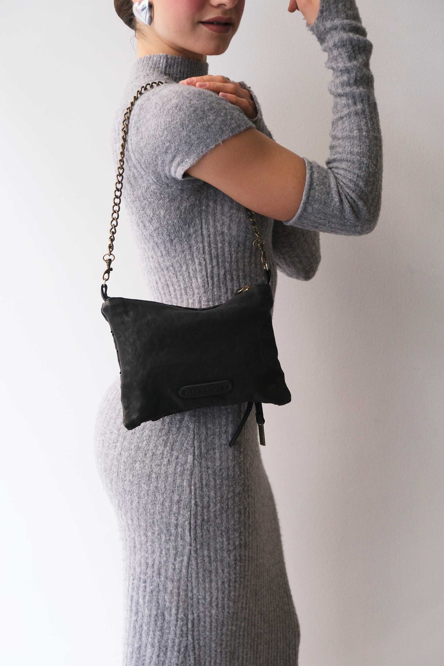 Mikin black pochette in taipan vegetable-tanned leather – Made in Italy -