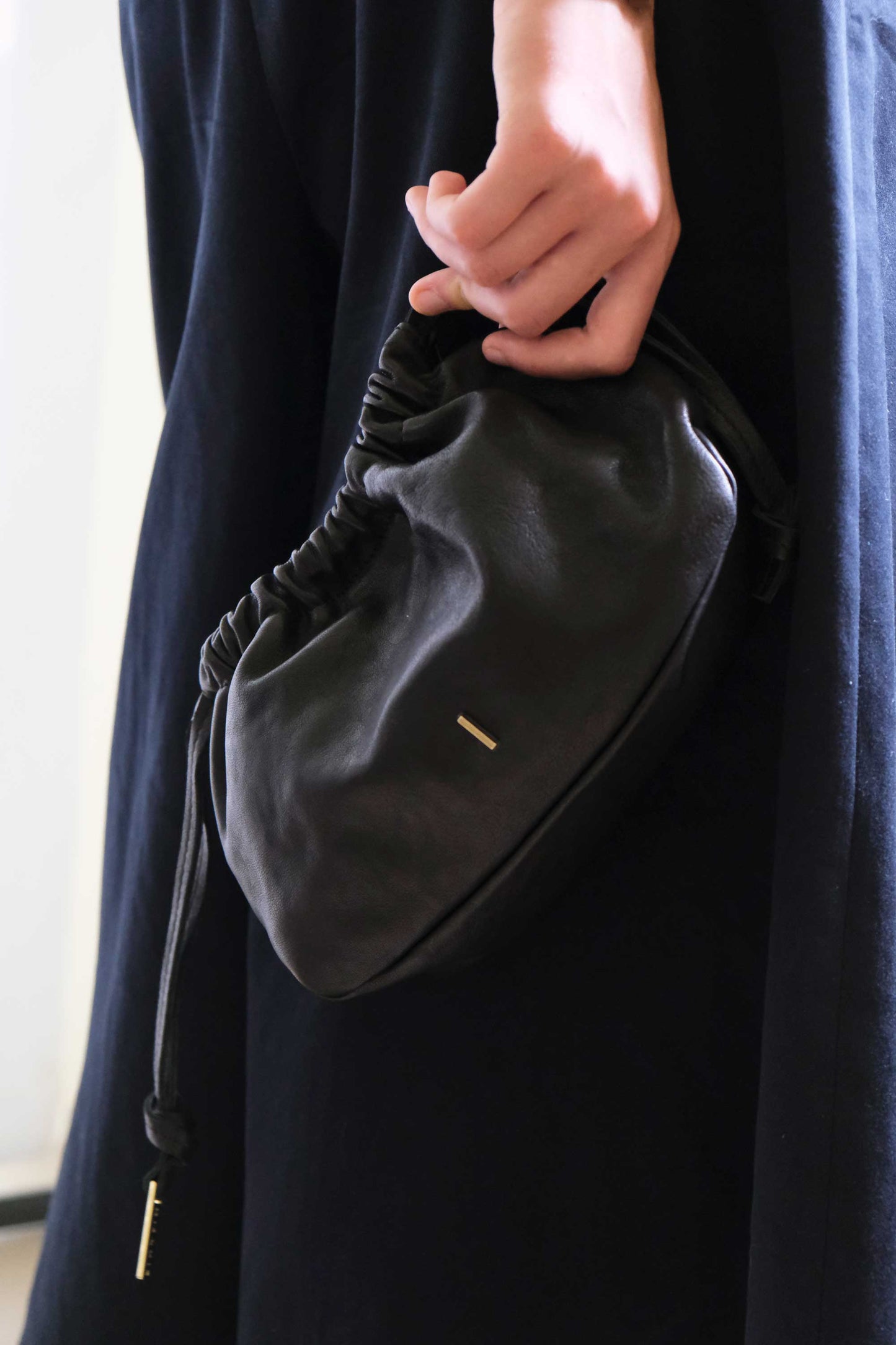 Agnes mini pochette in black nappa vegetable leather