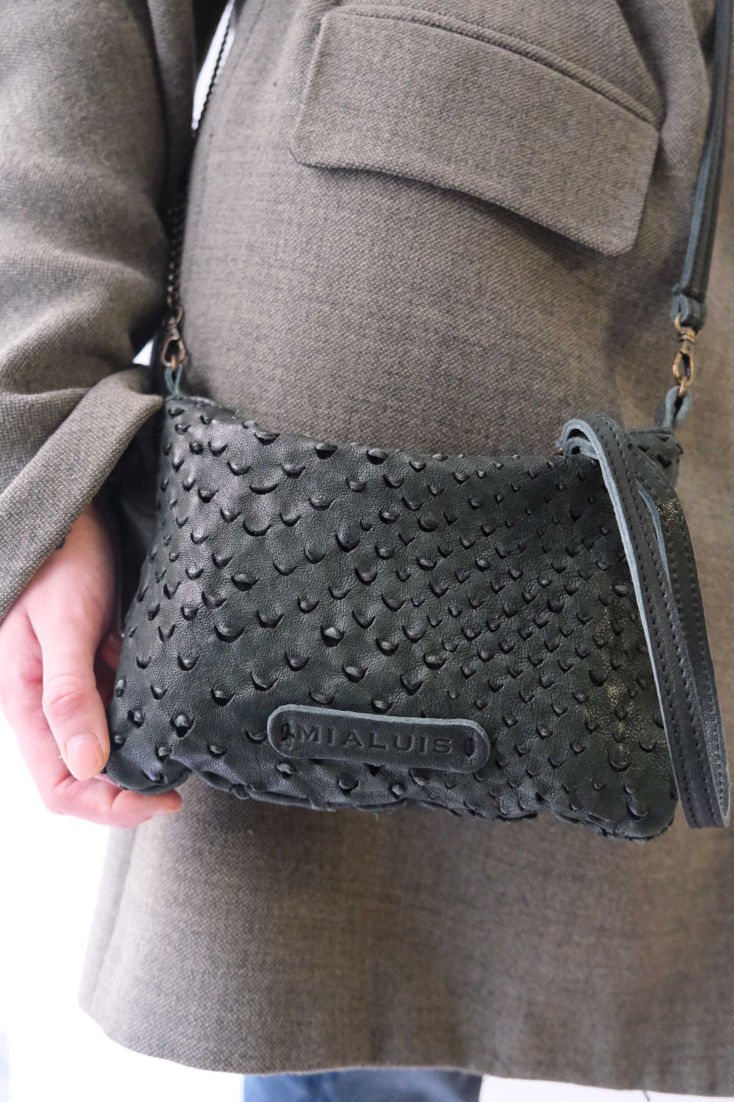 Tina pochette in pine perforated leather